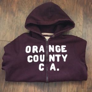 Men’s hooded, zipper Hollister sweatshirt.